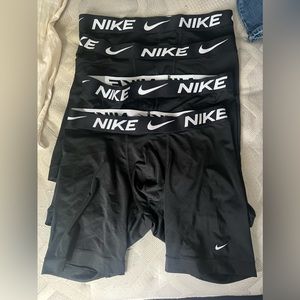 4 black pairs of Nike boxerbriefs size large